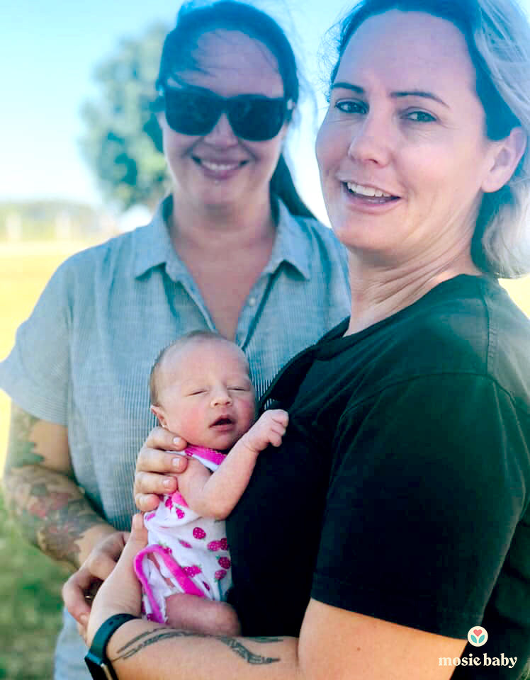 newborn mosie baby with her two moms