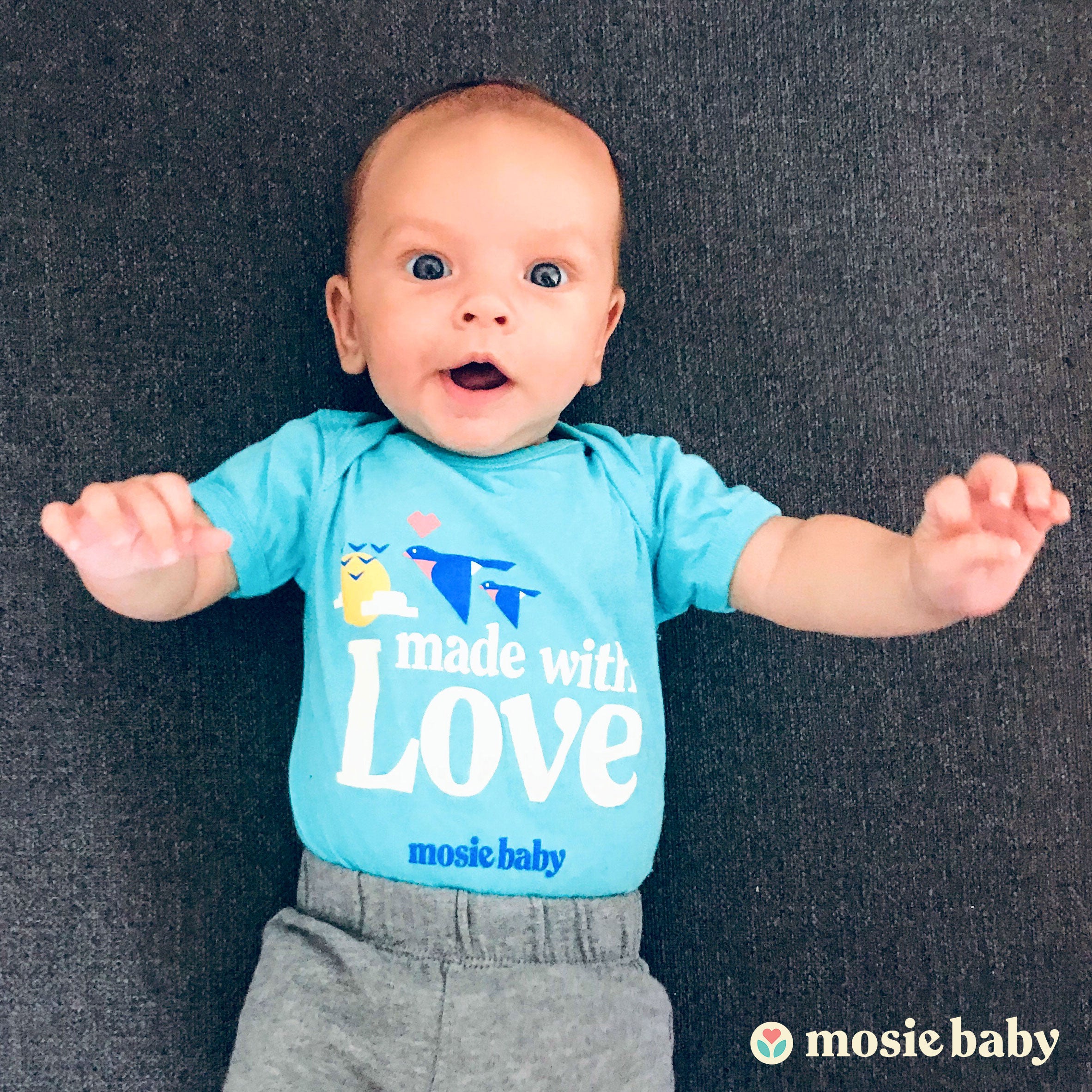 Mosie baby wearing Mosie onsesie