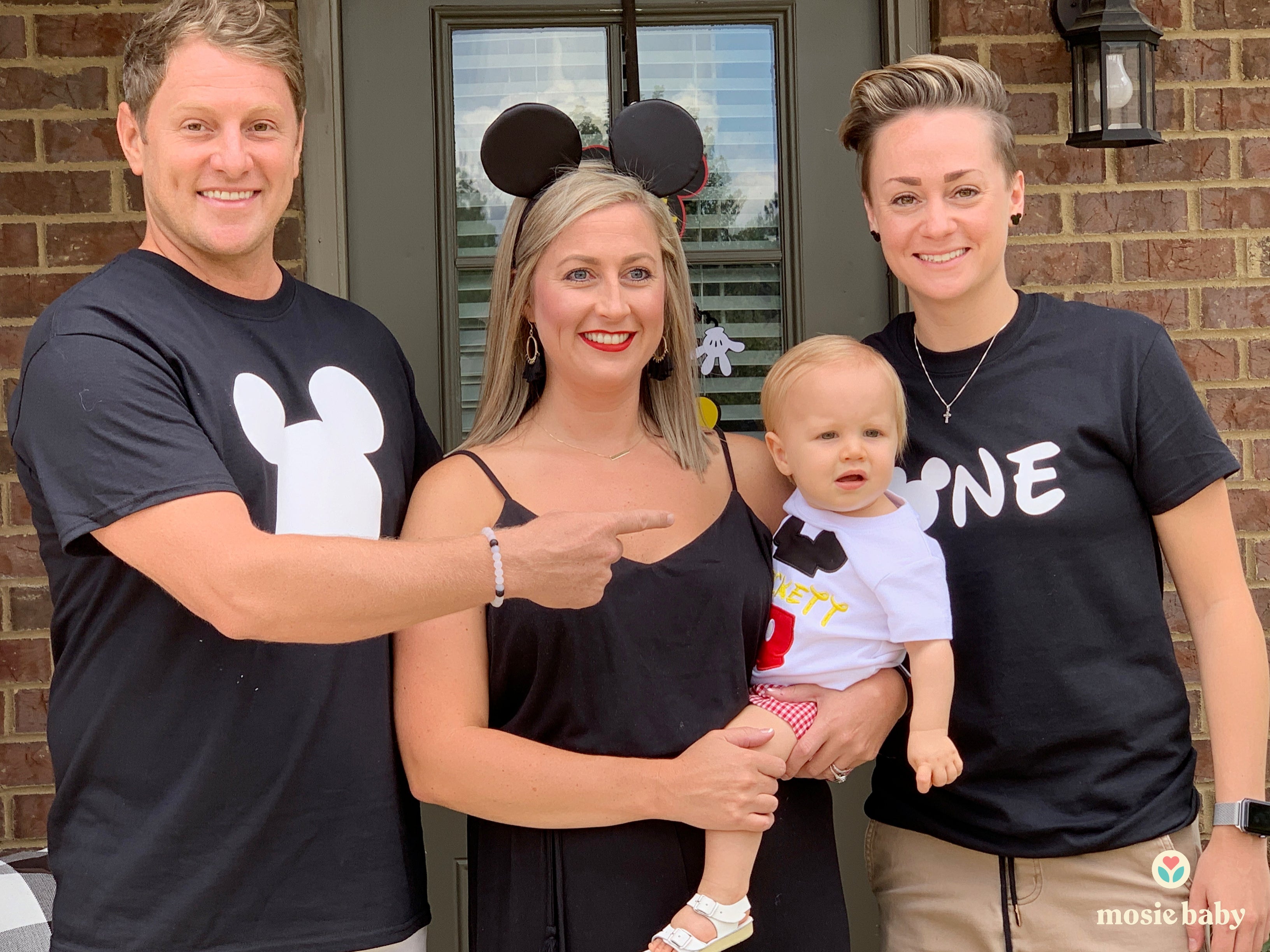 Mosie baby held by two moms and sperm donor